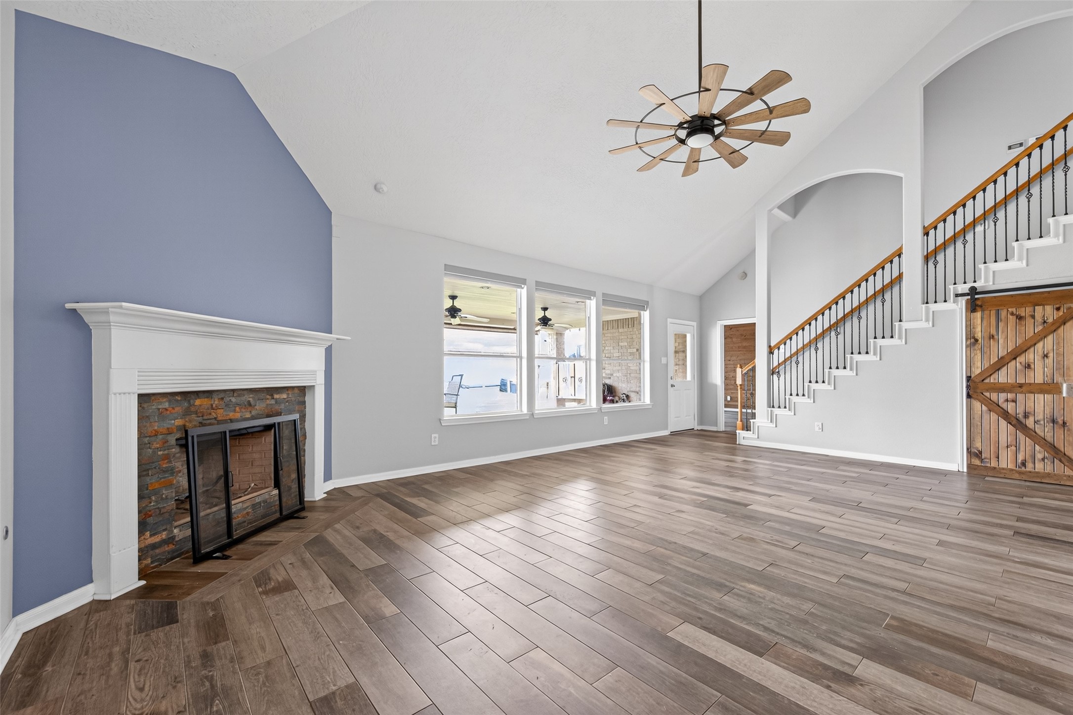 20827 Rose Crossing Lane Spring, TX 77379 - Photo 15 of 50 a view of an empty room with wooden floor fireplace and a window
