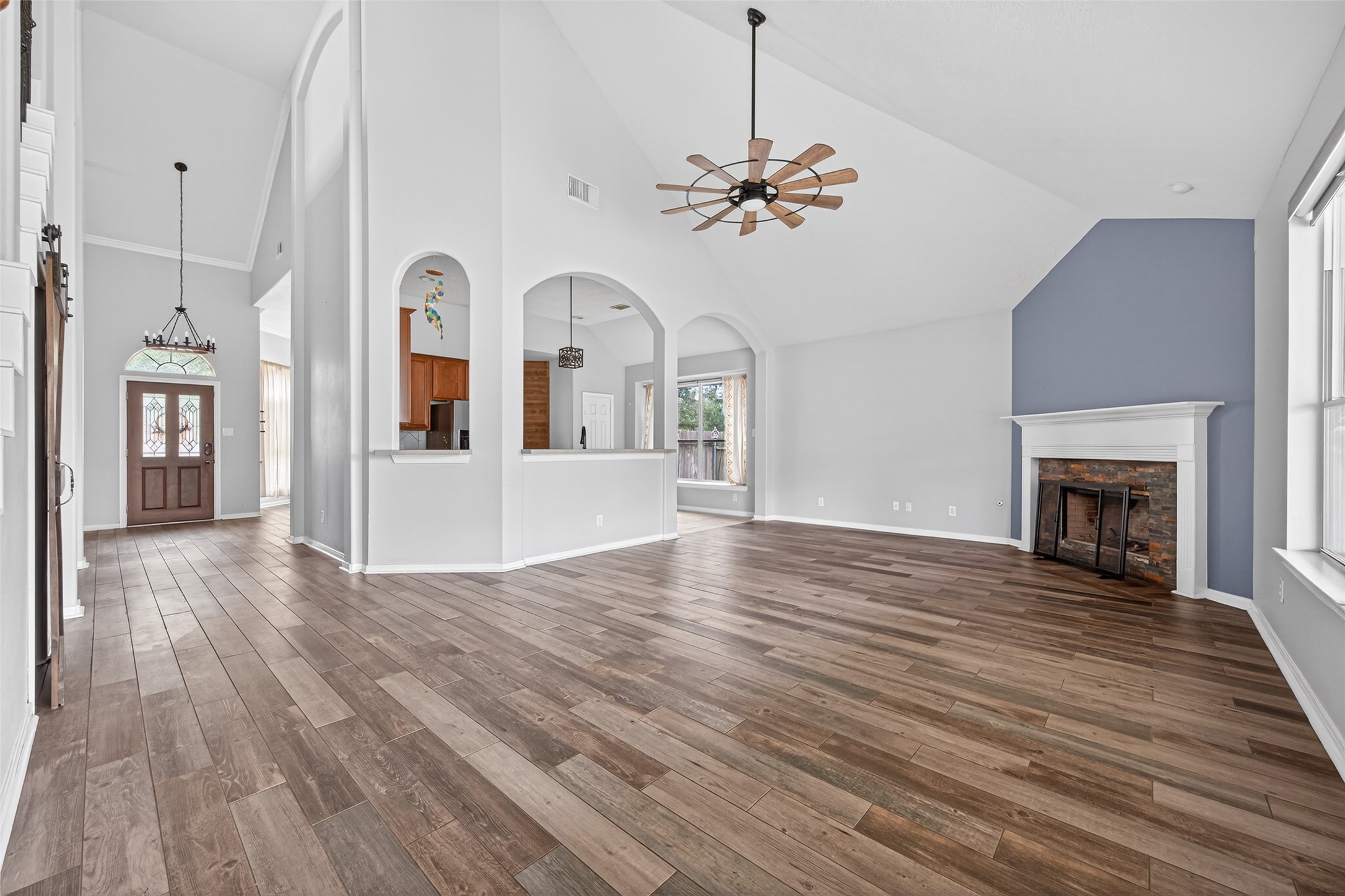 20827 Rose Crossing Lane Spring, TX 77379 - Photo 17 of 50 a view of livingroom and kitchen with wooden floor