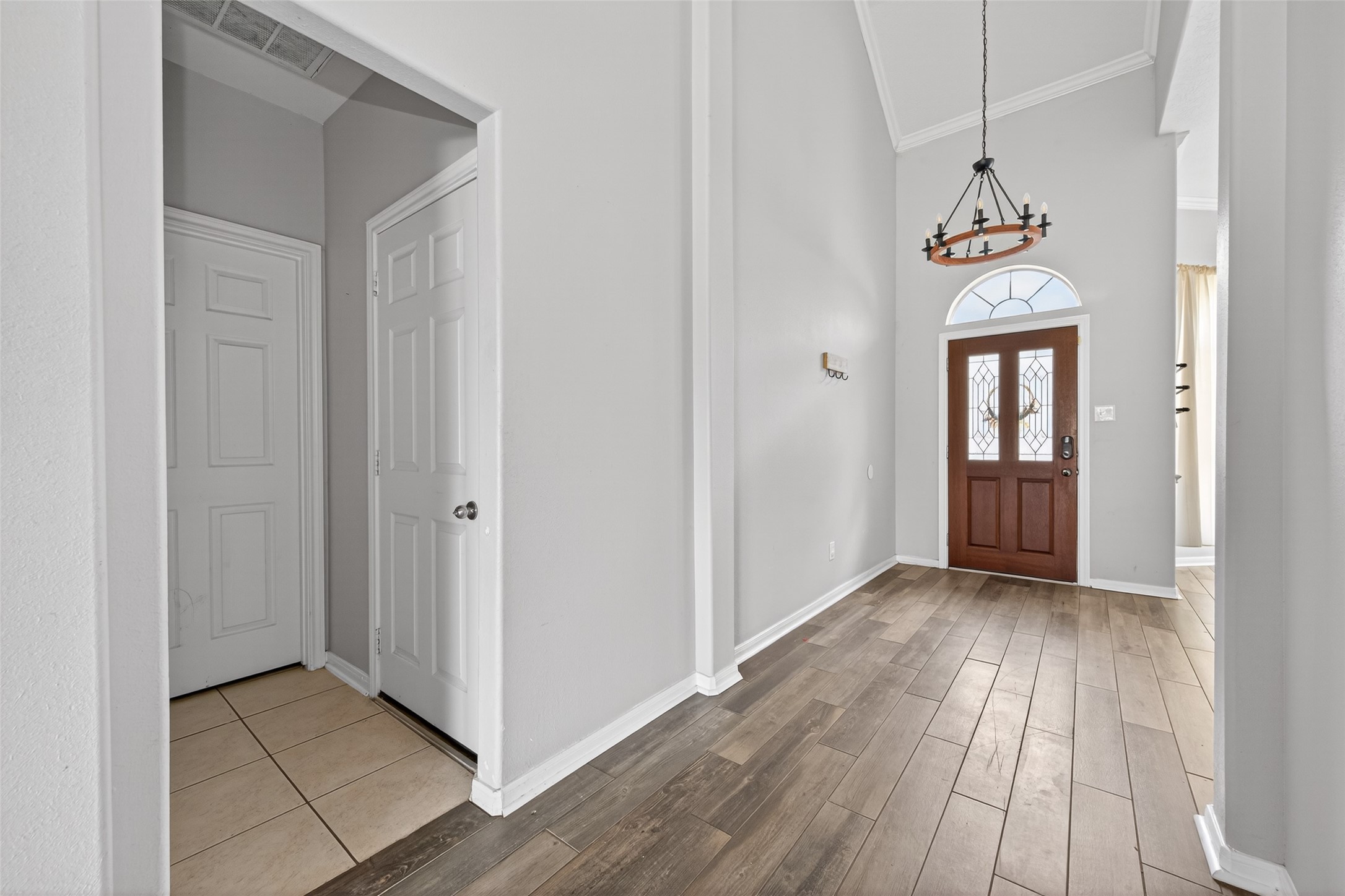 20827 Rose Crossing Lane Spring, TX 77379 - Photo 19 of 50 a view of a hallway view with wooden floor and staircase