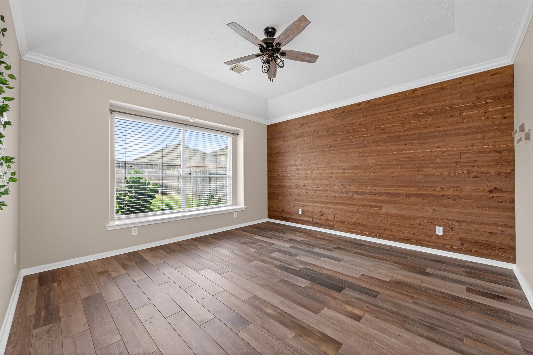 20827 Rose Crossing Lane Spring, TX 77379 - Photo 23 of 50 a view of an empty room with a window and wooden floor