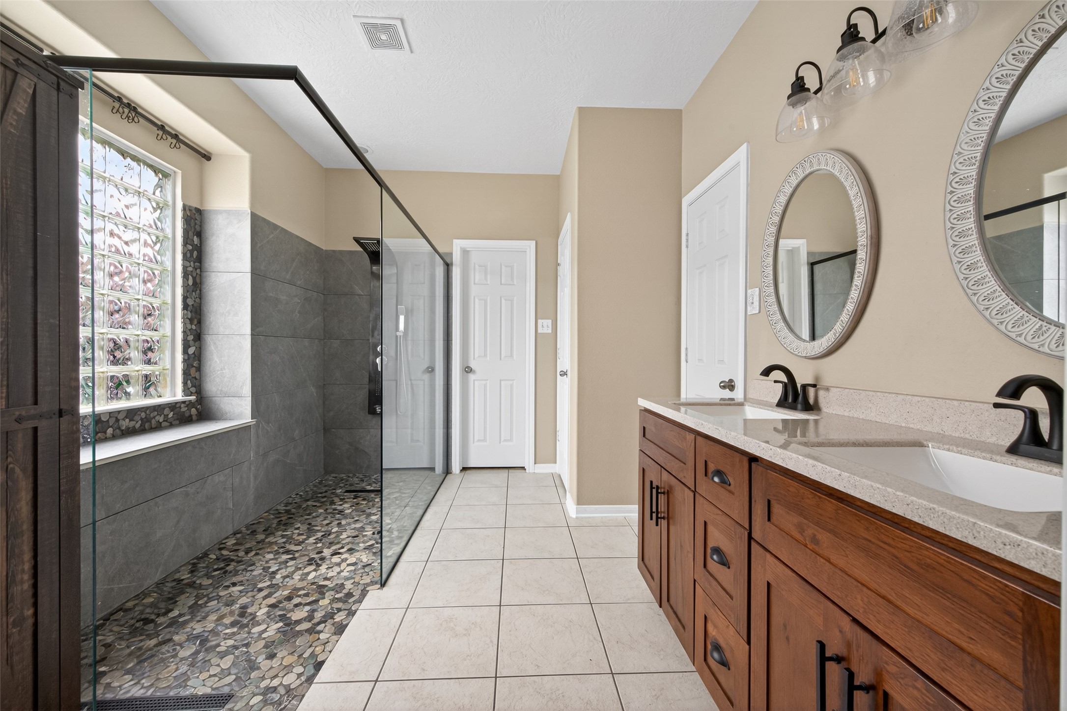 20827 Rose Crossing Lane Spring, TX 77379 - Photo 28 of 50 a spacious bathroom with a double vanity sink a mirror and a shower