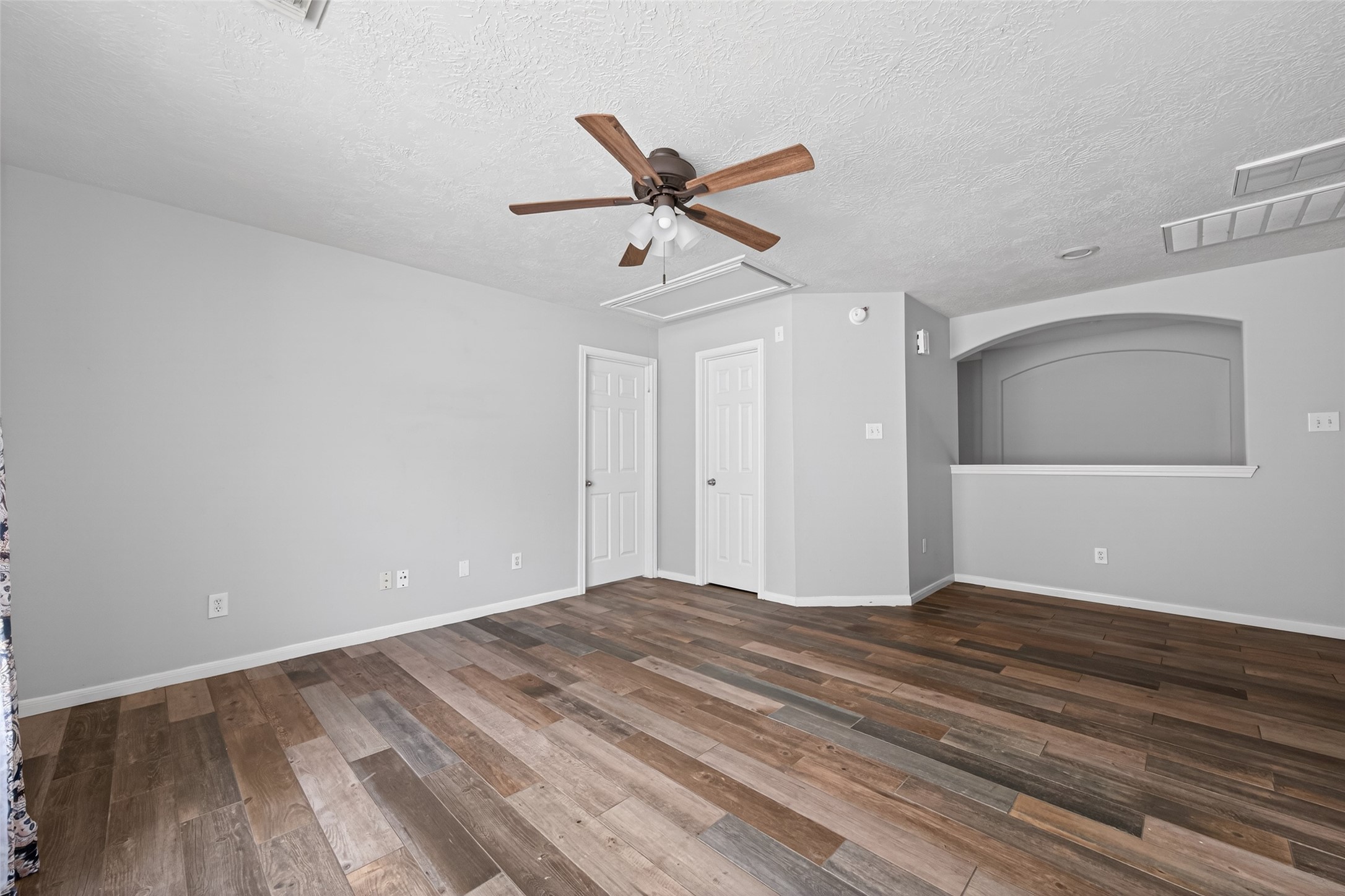 20827 Rose Crossing Lane Spring, TX 77379 - Photo 35 of 50 a view of empty room with wooden floor and ceiling fan