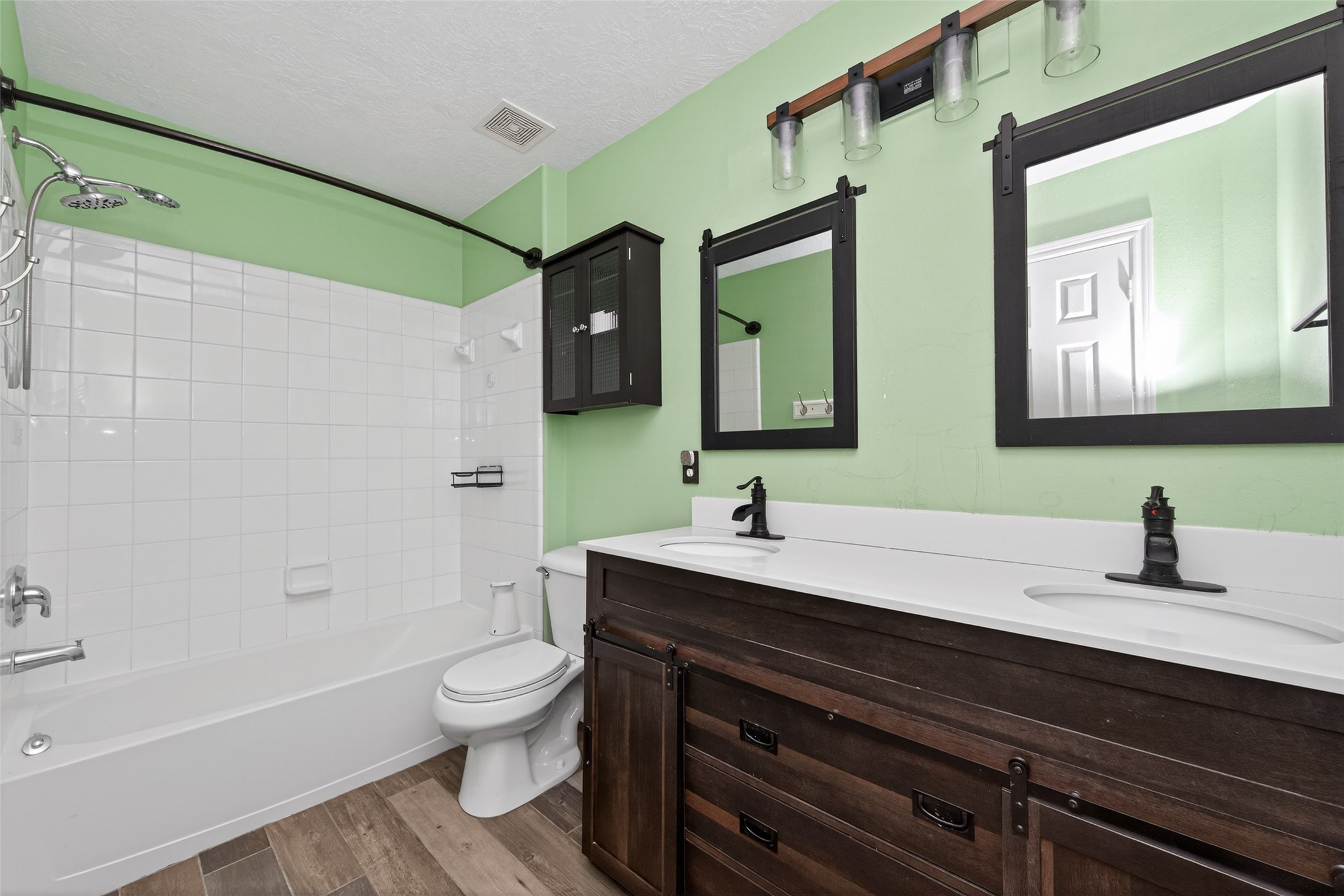 20827 Rose Crossing Lane Spring, TX 77379 - Photo 39 of 50 a bathroom with a toilet a sink and a bathtub