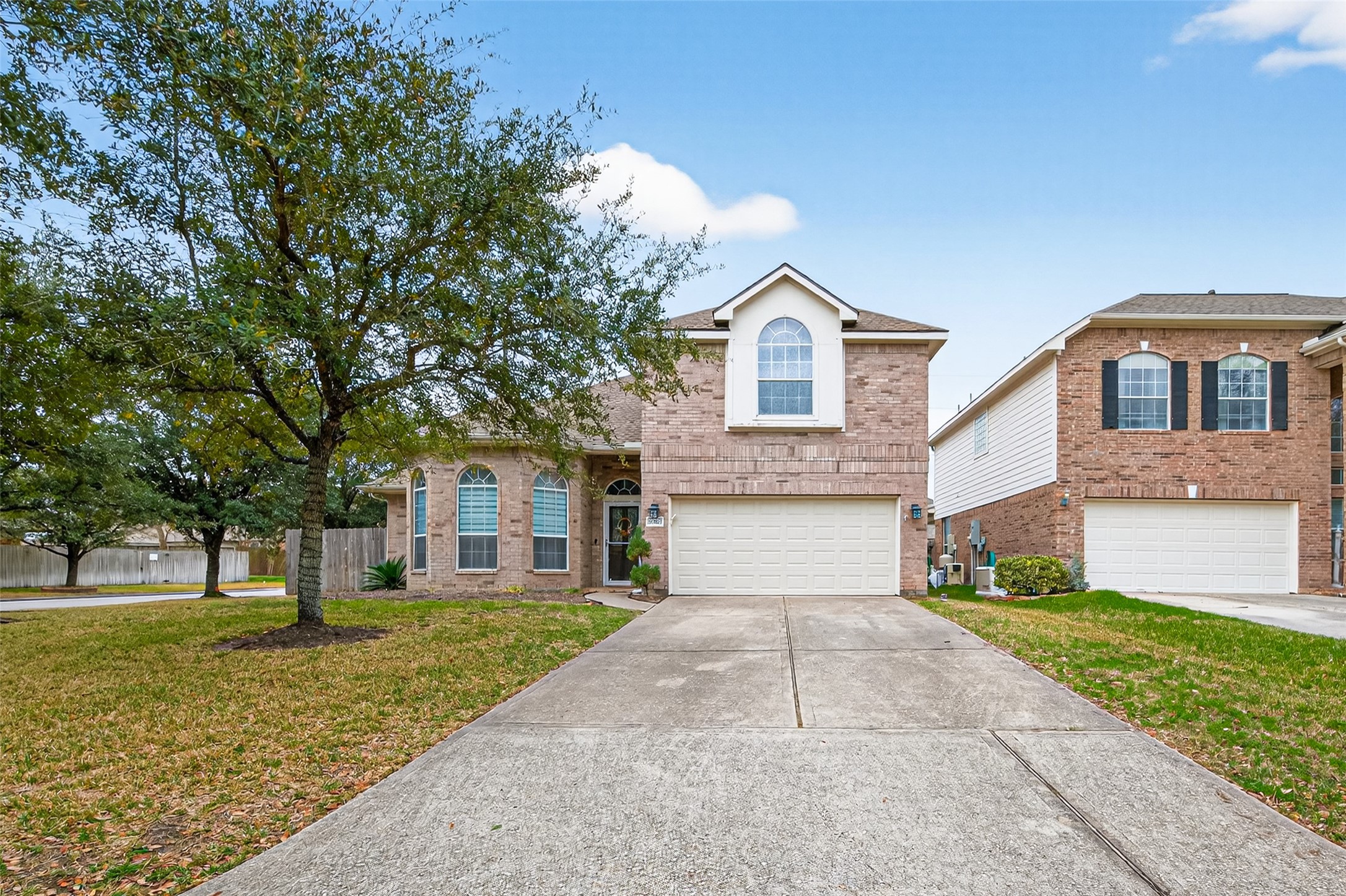 20827 Rose Crossing Lane Spring, TX 77379 - Photo 49 of 50 a front view of a house with a yard and trees