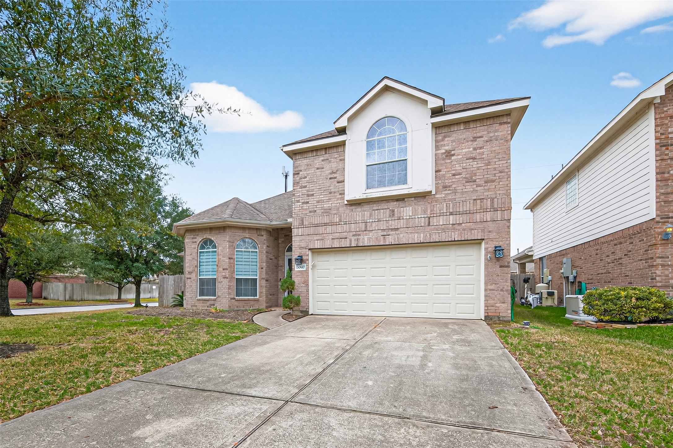 20827 Rose Crossing Lane Spring, TX 77379 - Photo 50 of 50 a front view of a house with a yard and garage