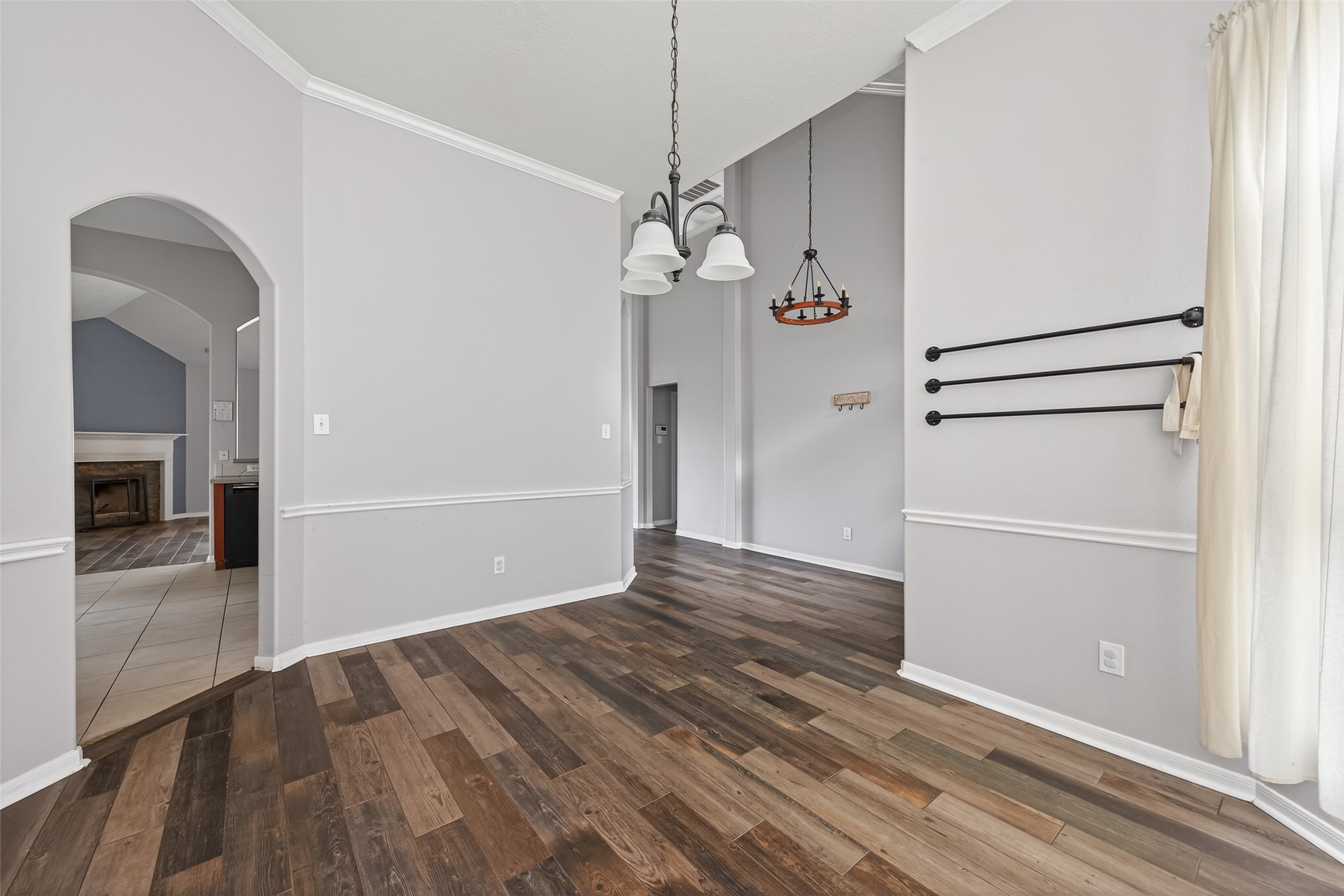 20827 Rose Crossing Lane Spring, TX 77379 - Photo 7 of 50 a view of a hallway with wooden floor and a chandelier