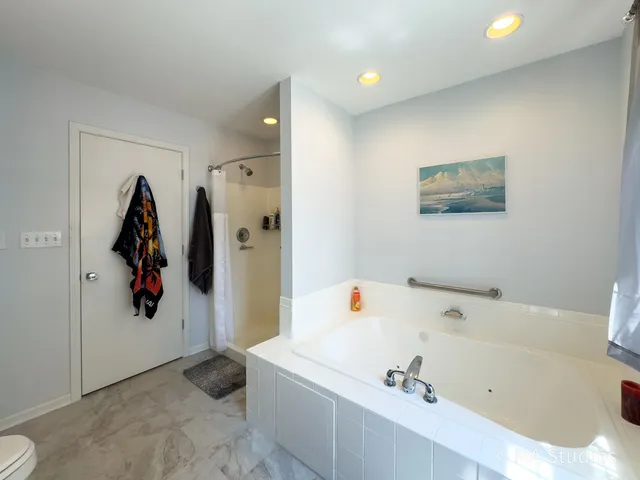 a bathroom with a sink a toilet and tub