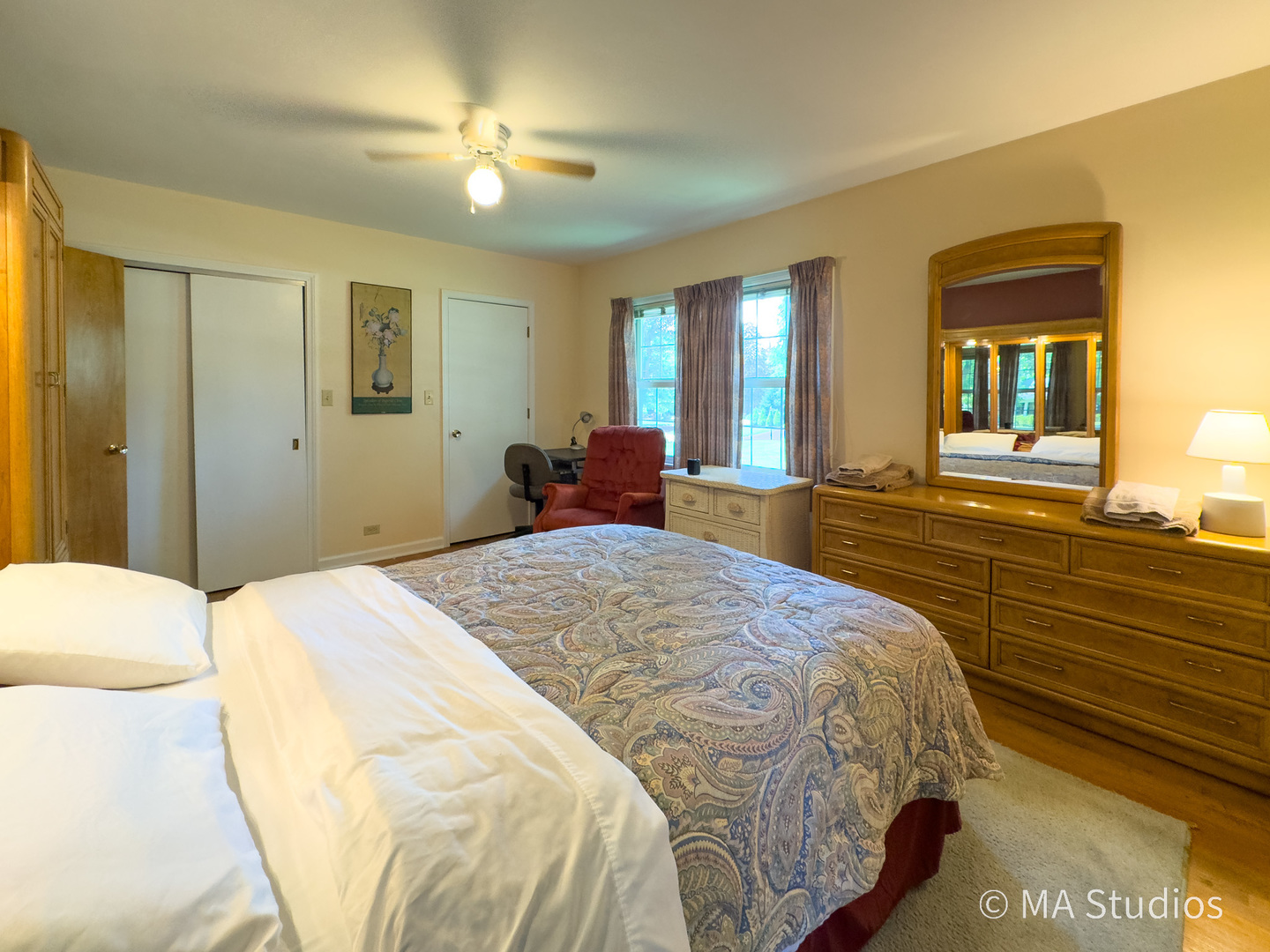 1219 Golf Lane Wheaton, IL 60189 - Photo 22 of 67 a bedroom with a bed and a chandelier