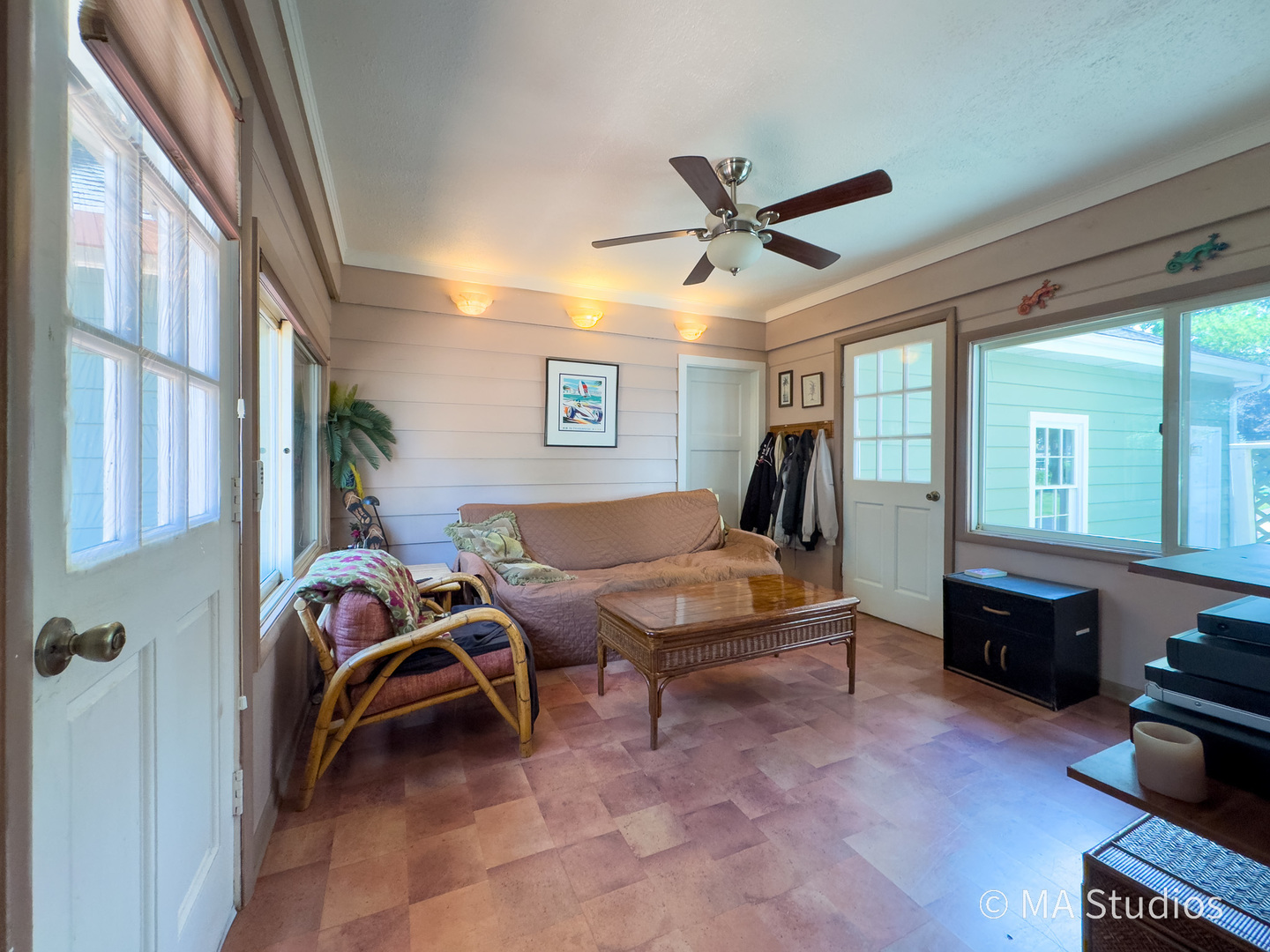 1219 Golf Lane Wheaton, IL 60189 - Photo 28 of 67 a living room with furniture gym equipment and a large window