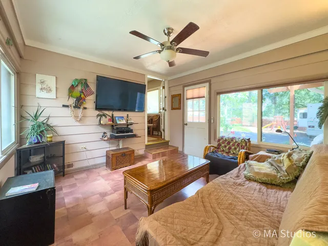 a kitchen with cabinets stainless steel appliances and a window