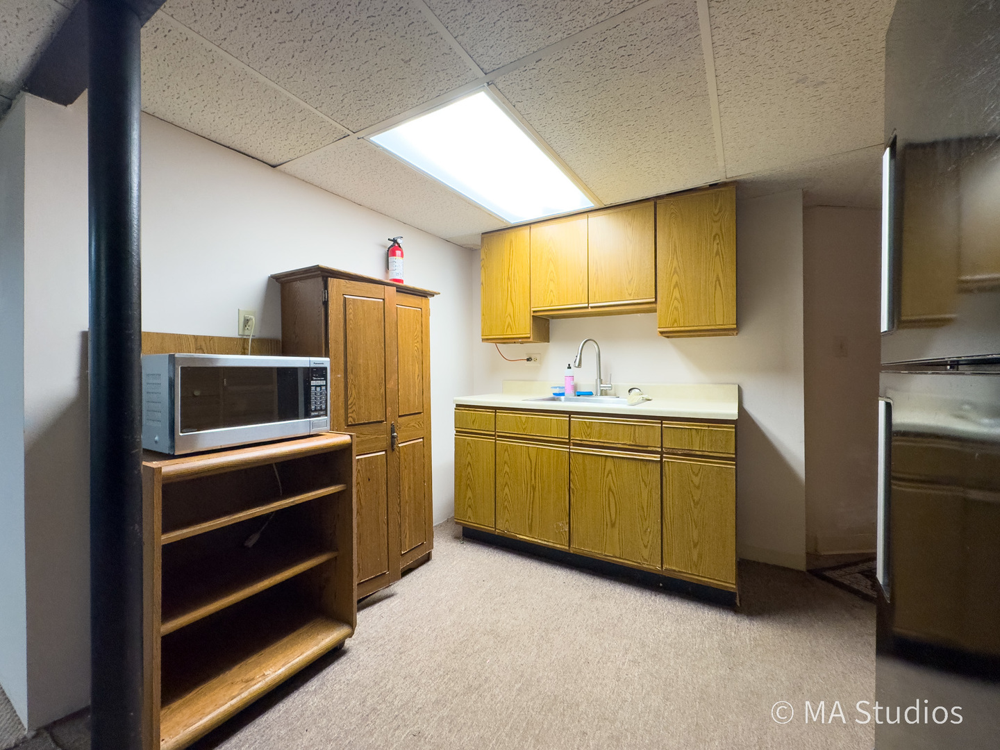 1219 Golf Lane Wheaton, IL 60189 - Photo 33 of 67 a kitchen with cabinets stainless steel appliances and a window