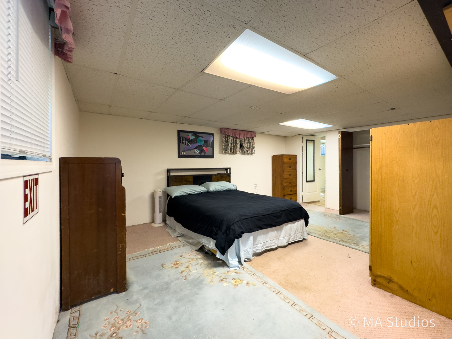 1219 Golf Lane Wheaton, IL 60189 - Photo 36 of 67 a bedroom with a bed dresser and a large mirror