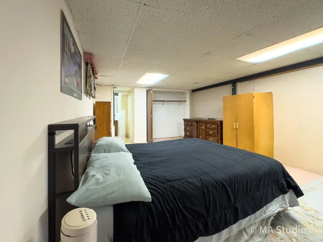 a view of green field with trees in the background