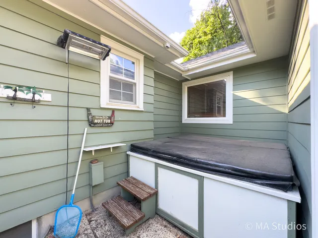an aerial view of a house with yard