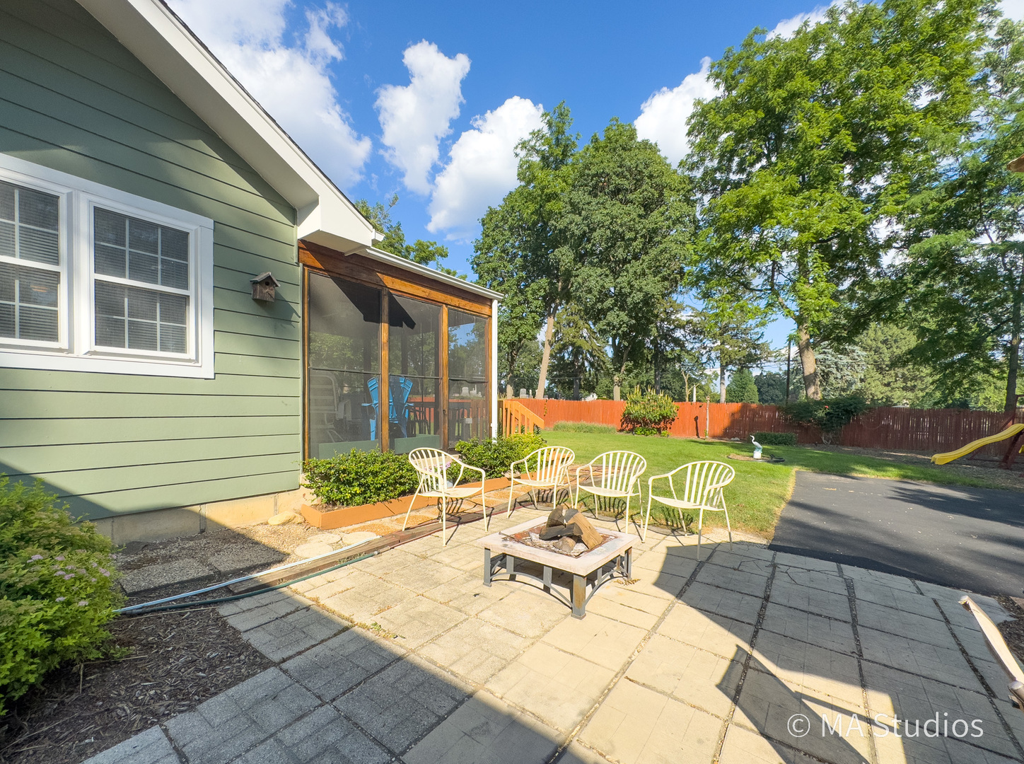 1219 Golf Lane Wheaton, IL 60189 - Photo 60 of 67 a view of a patio with table and chairs and potted plants