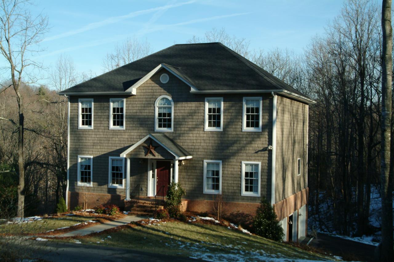 5780 Lost Mountain Road Roanoke, VA 24018 - Photo 1 of 16 a front view of a house with a yard