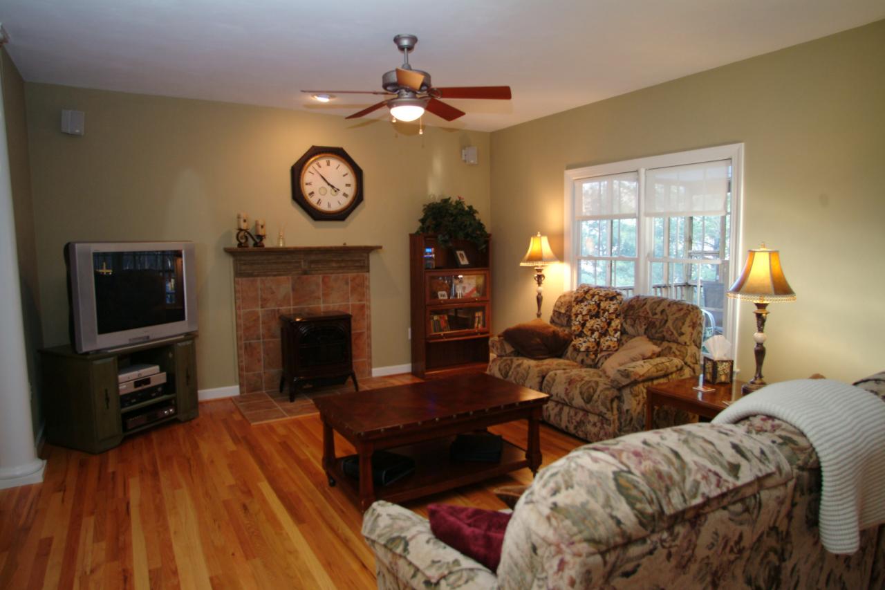 5780 Lost Mountain Road Roanoke, VA 24018 - Photo 4 of 16 a living room with furniture a fireplace and a flat screen tv