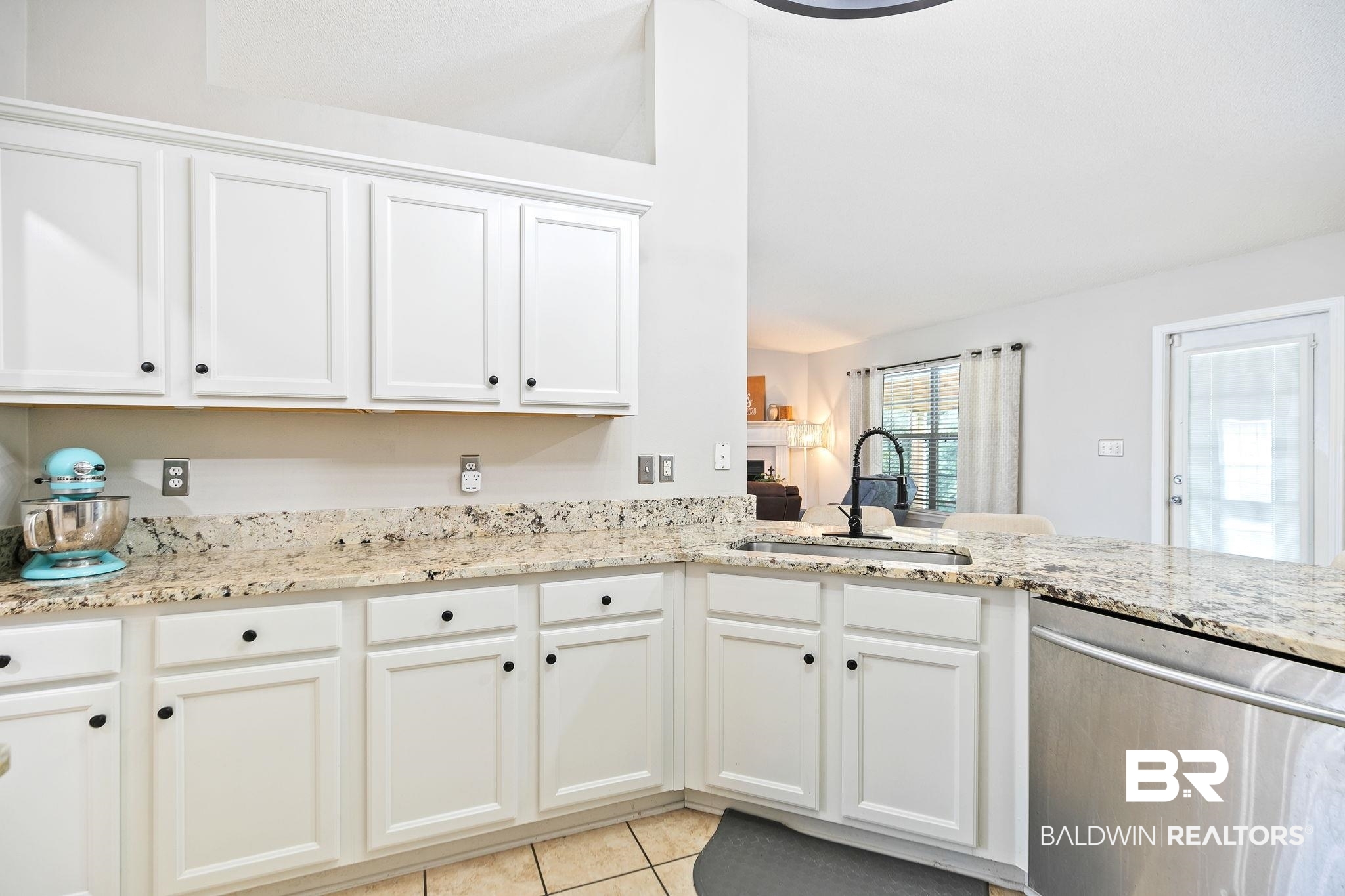 28246 Turkey Branch Drive Daphne, AL 36526 - Photo 13 of 41 Kitchen with light stone counters, white cabinetry, dishwasher, light tile patterned flooring, and sink