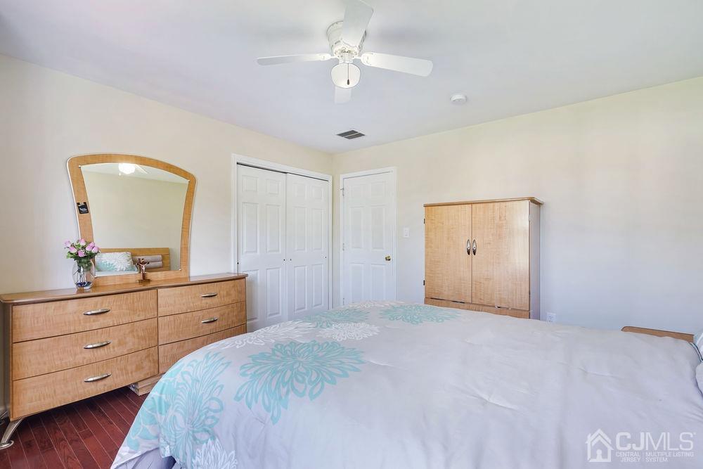 52 Cannon Road Old Bridge, NJ 08857 - Photo 23 of 45 a bedroom with a large bed and a dresser