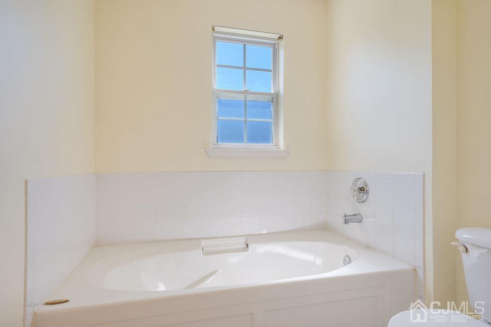 52 Cannon Road Old Bridge, NJ 08857 - Photo 33 of 45 a bathroom with a bathtub