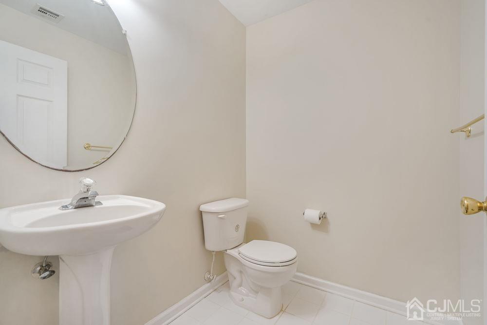52 Cannon Road Old Bridge, NJ 08857 - Photo 36 of 45 a bathroom with a sink a mirror and toilet