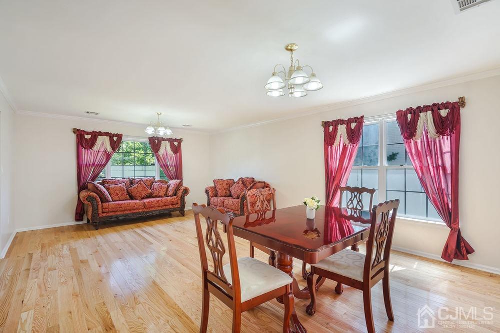 52 Cannon Road Old Bridge, NJ 08857 - Photo 6 of 45 a view of a dining room with furniture wooden floor and a chandelier