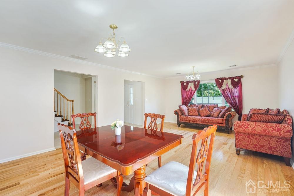 52 Cannon Road Old Bridge, NJ 08857 - Photo 7 of 45 a view of a dining room with furniture and wooden floor