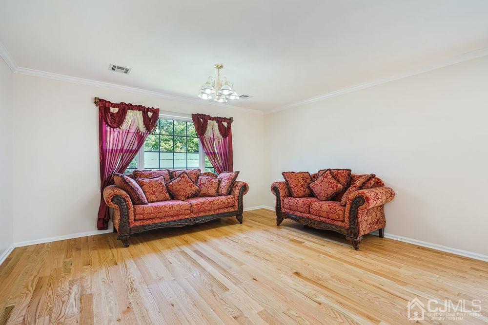 52 Cannon Road Old Bridge, NJ 08857 - Photo 8 of 45 a living room with furniture and a wooden floor