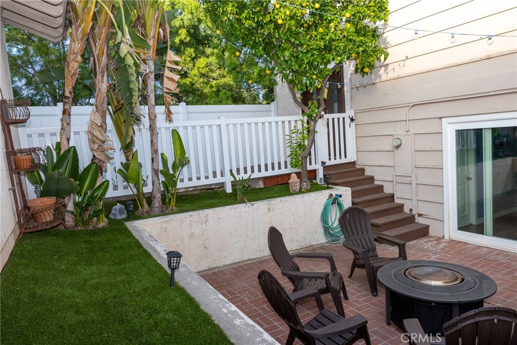 a view of a chairs and table in patio