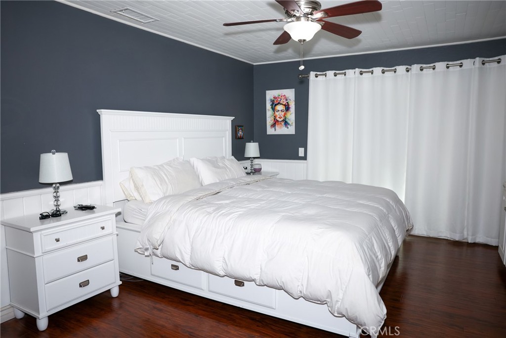 2216 El Capitan Drive Riverside, CA 92506 - Photo 11 of 39 a bedroom with a bed and a ceiling fan