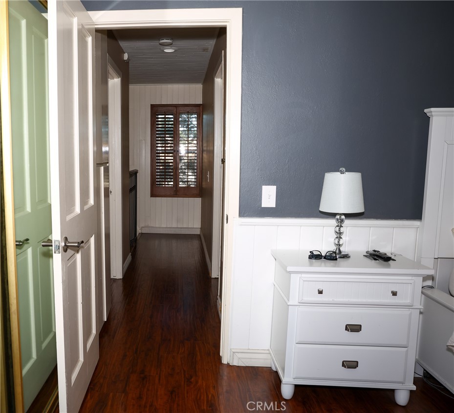 2216 El Capitan Drive Riverside, CA 92506 - Photo 13 of 39 a view of a hallway with wooden floor cabinet and a bathroom