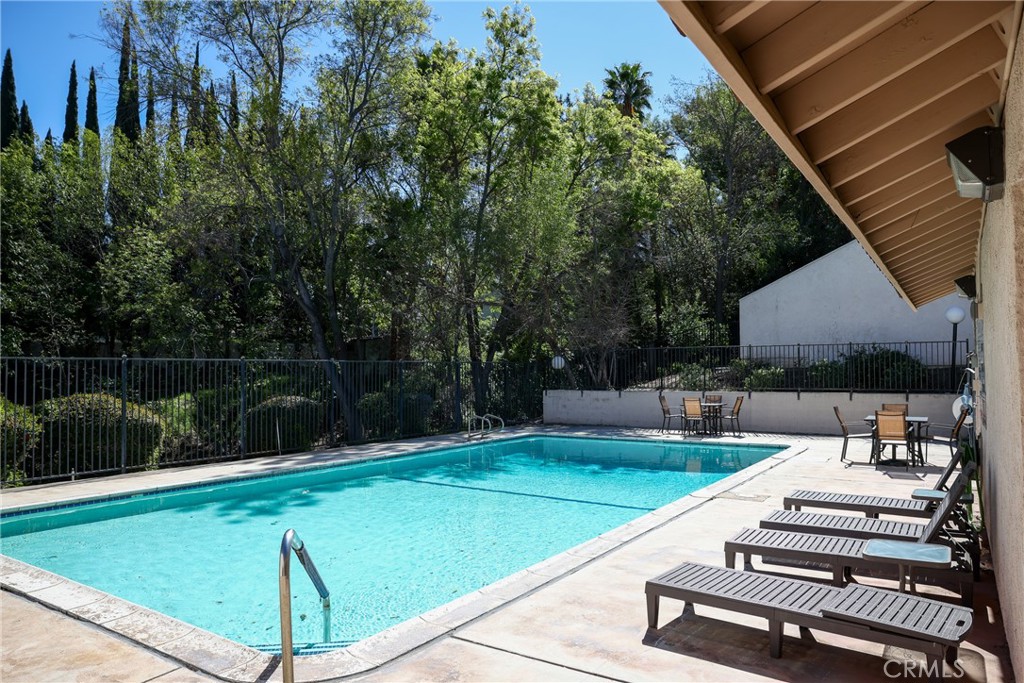 2216 El Capitan Drive Riverside, CA 92506 - Photo 29 of 39 a view of a swimming pool with a patio