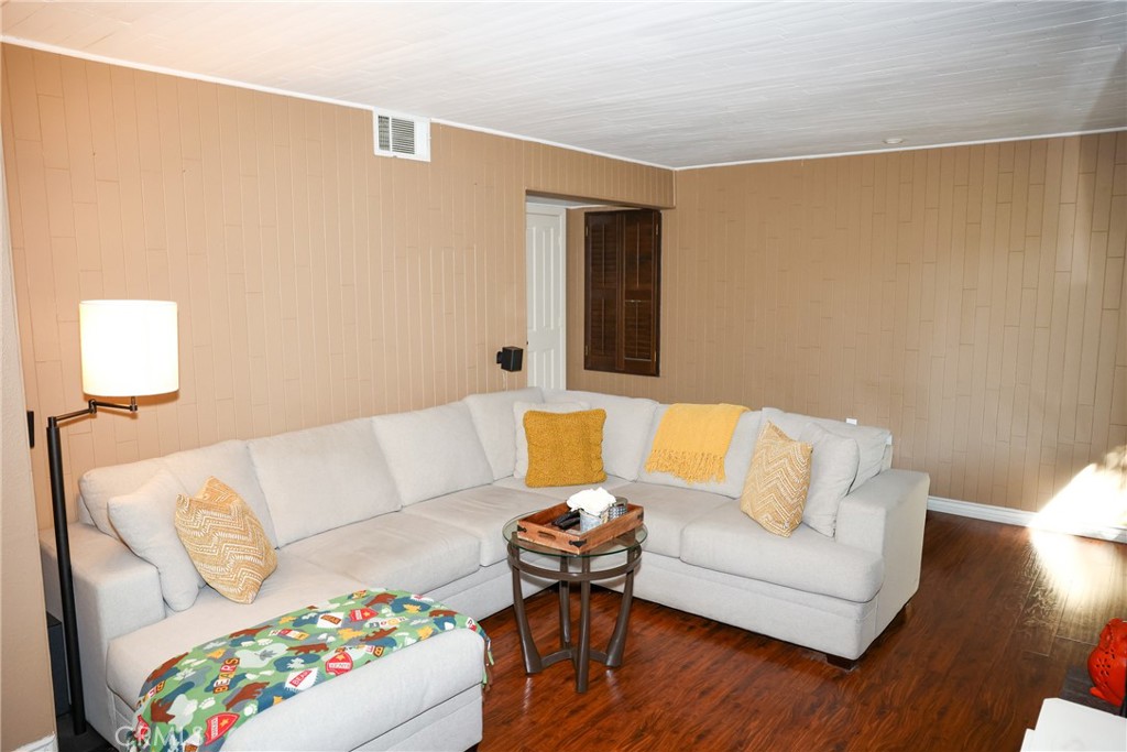 2216 El Capitan Drive Riverside, CA 92506 - Photo 4 of 39 a living room with furniture and wooden floor