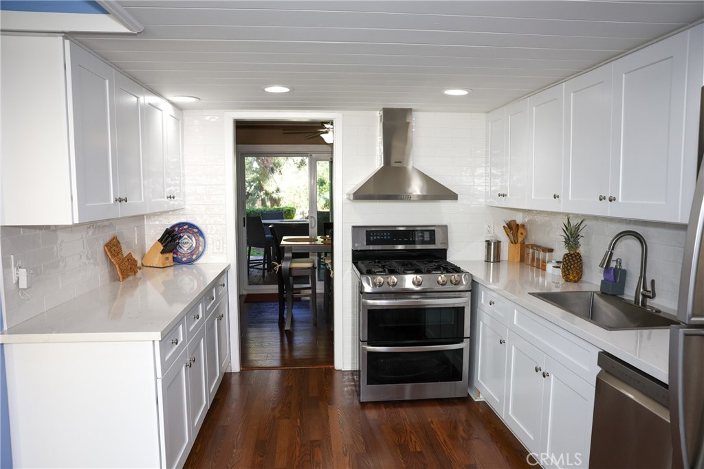 2216 El Capitan Drive Riverside, CA 92506 - Photo 6 of 39 a kitchen with stainless steel appliances granite countertop a stove a sink and a refrigerator
