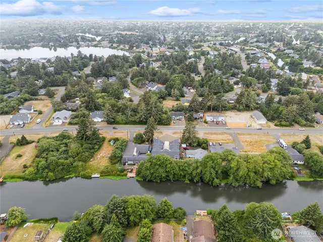 an aerial view of a house with a lake view