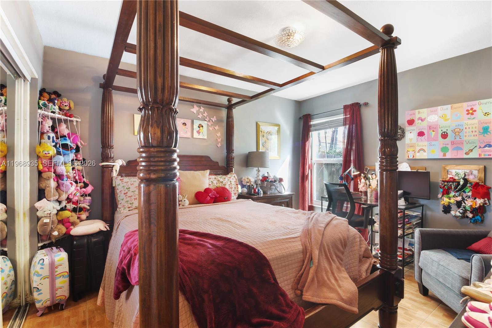 16323 Southwest 103rd Place Miami, FL 33157 - Photo 12 of 42 a bedroom with a bed and a window