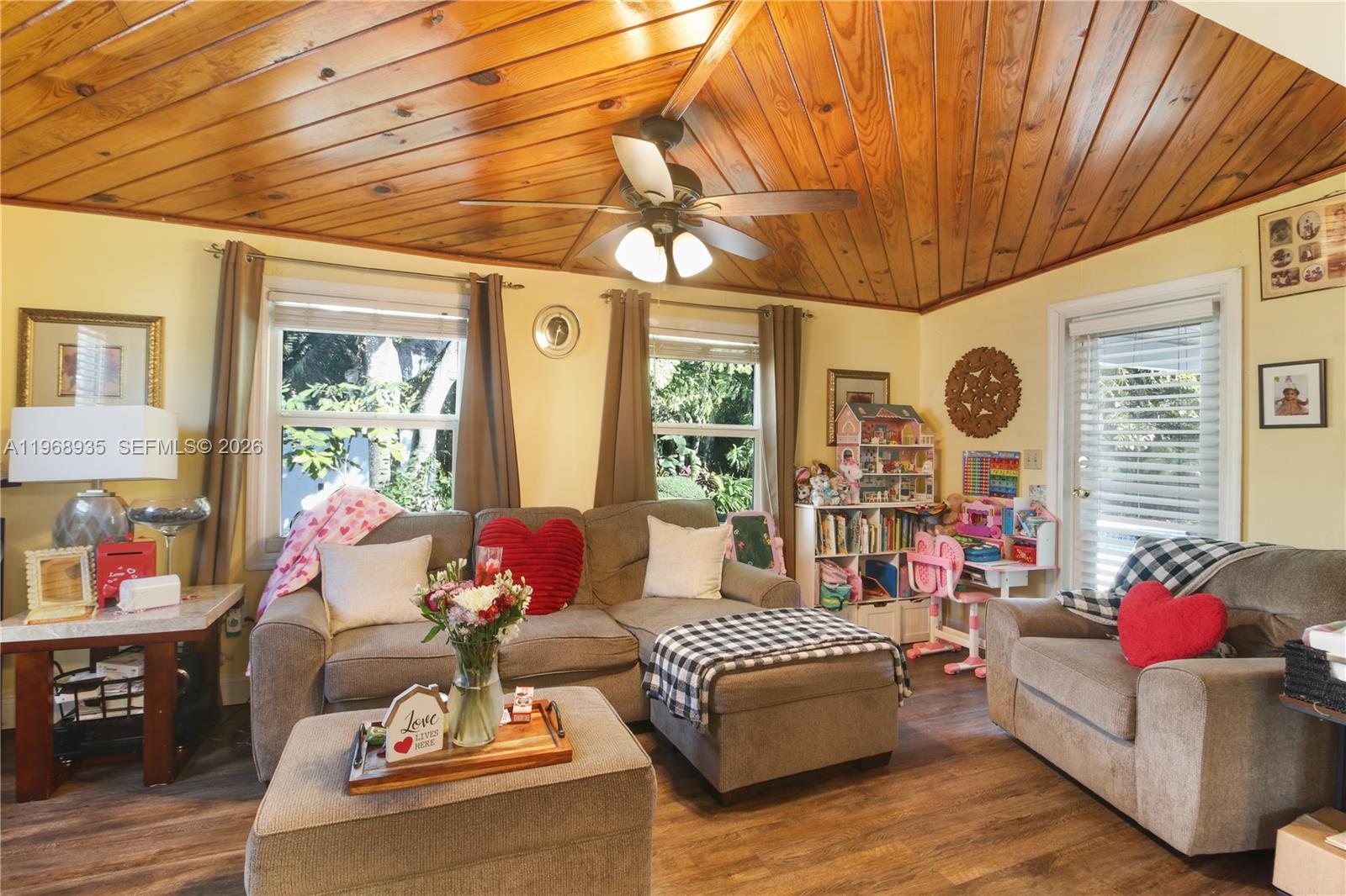 16323 Southwest 103rd Place Miami, FL 33157 - Photo 25 of 42 a living room with furniture and a large window