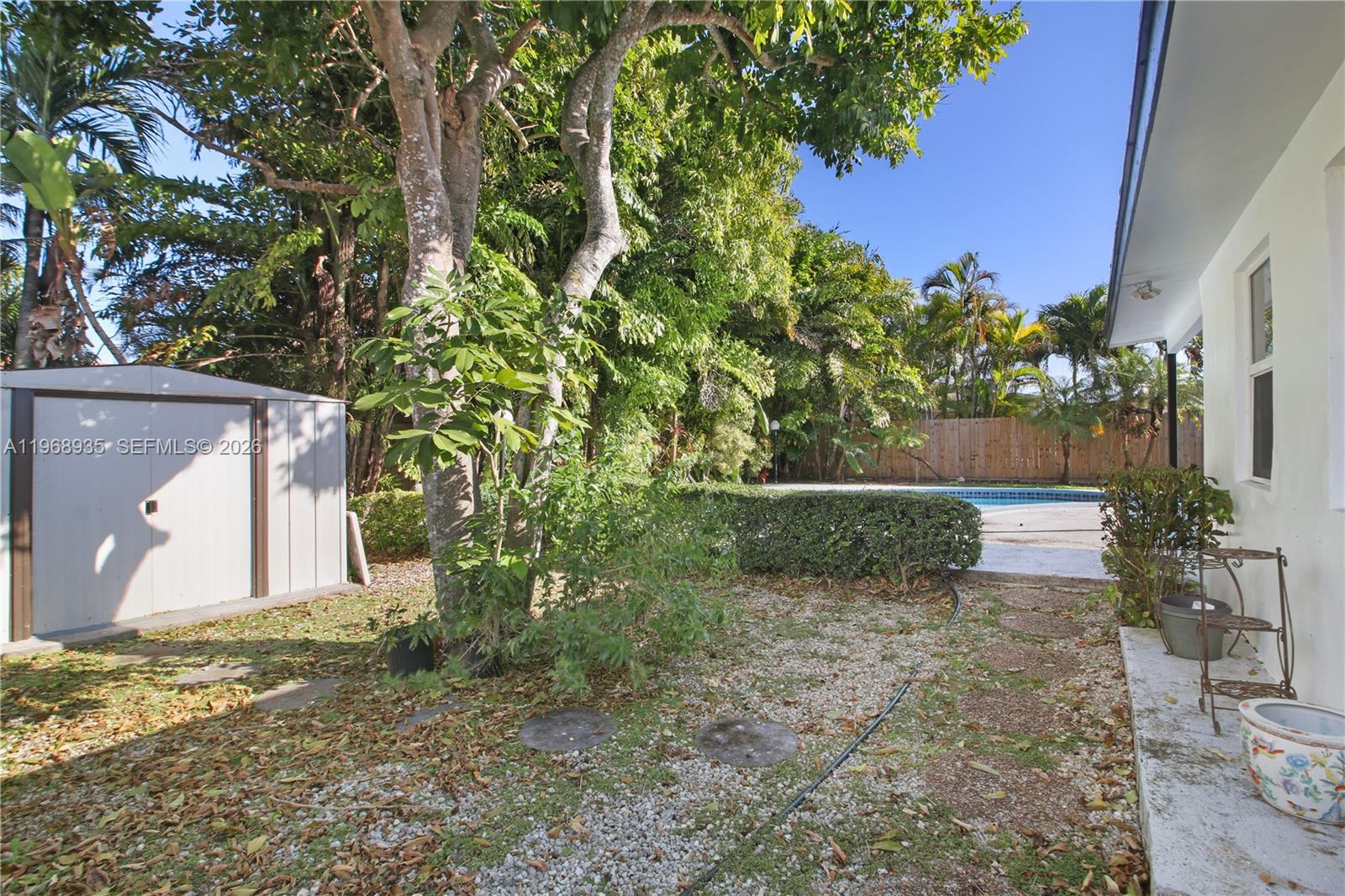 16323 Southwest 103rd Place Miami, FL 33157 - Photo 30 of 42 a view of a house with a yard and tree