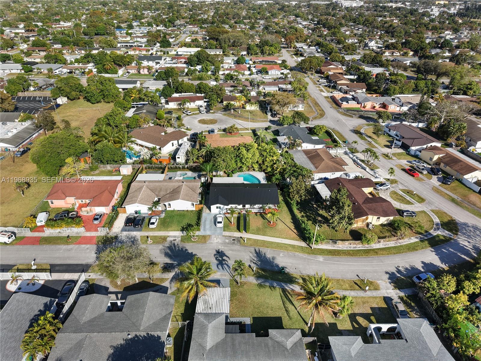 16323 Southwest 103rd Place Miami, FL 33157 - Photo 39 of 42 an aerial view of residential houses with outdoor space