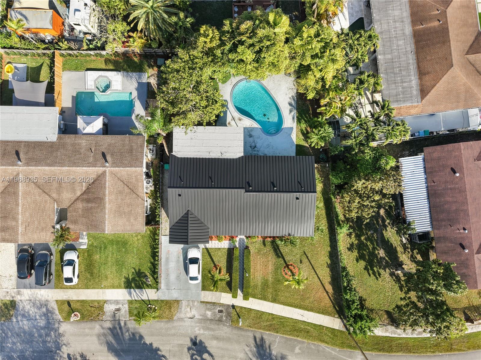 16323 Southwest 103rd Place Miami, FL 33157 - Photo 4 of 42 an aerial view of a house with a yard
