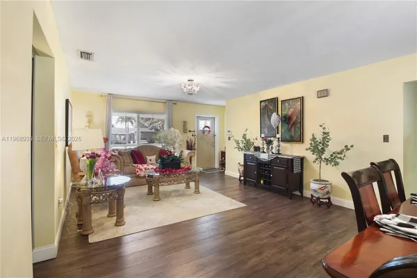 a living room with furniture window and wooden floor