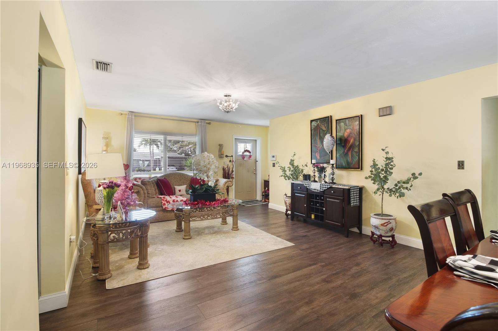 16323 Southwest 103rd Place Miami, FL 33157 - Photo 9 of 42 a living room with furniture window and wooden floor