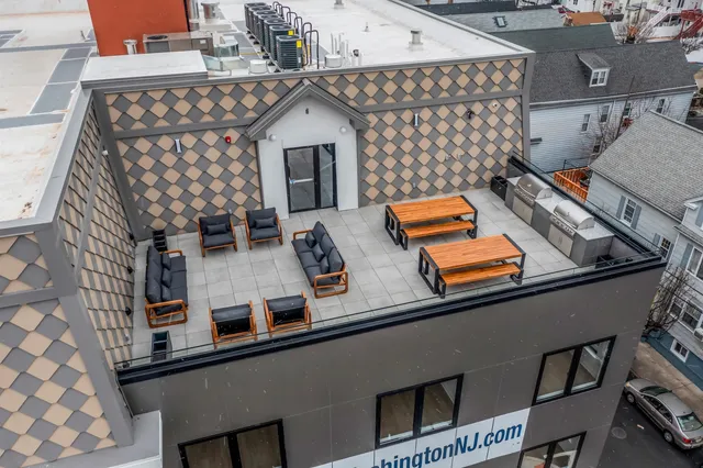 a view of a balcony with chairs