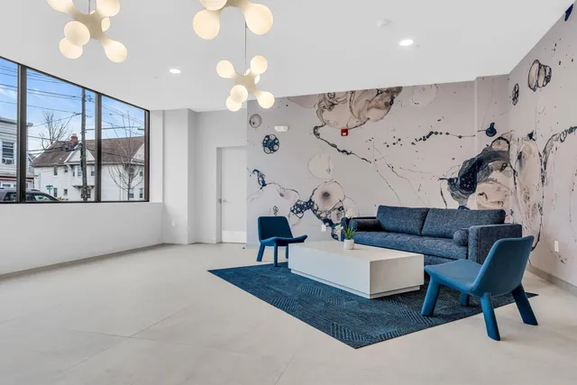 a living room with furniture and a large window