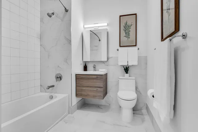 a bathroom with a toilet sink and bathtub