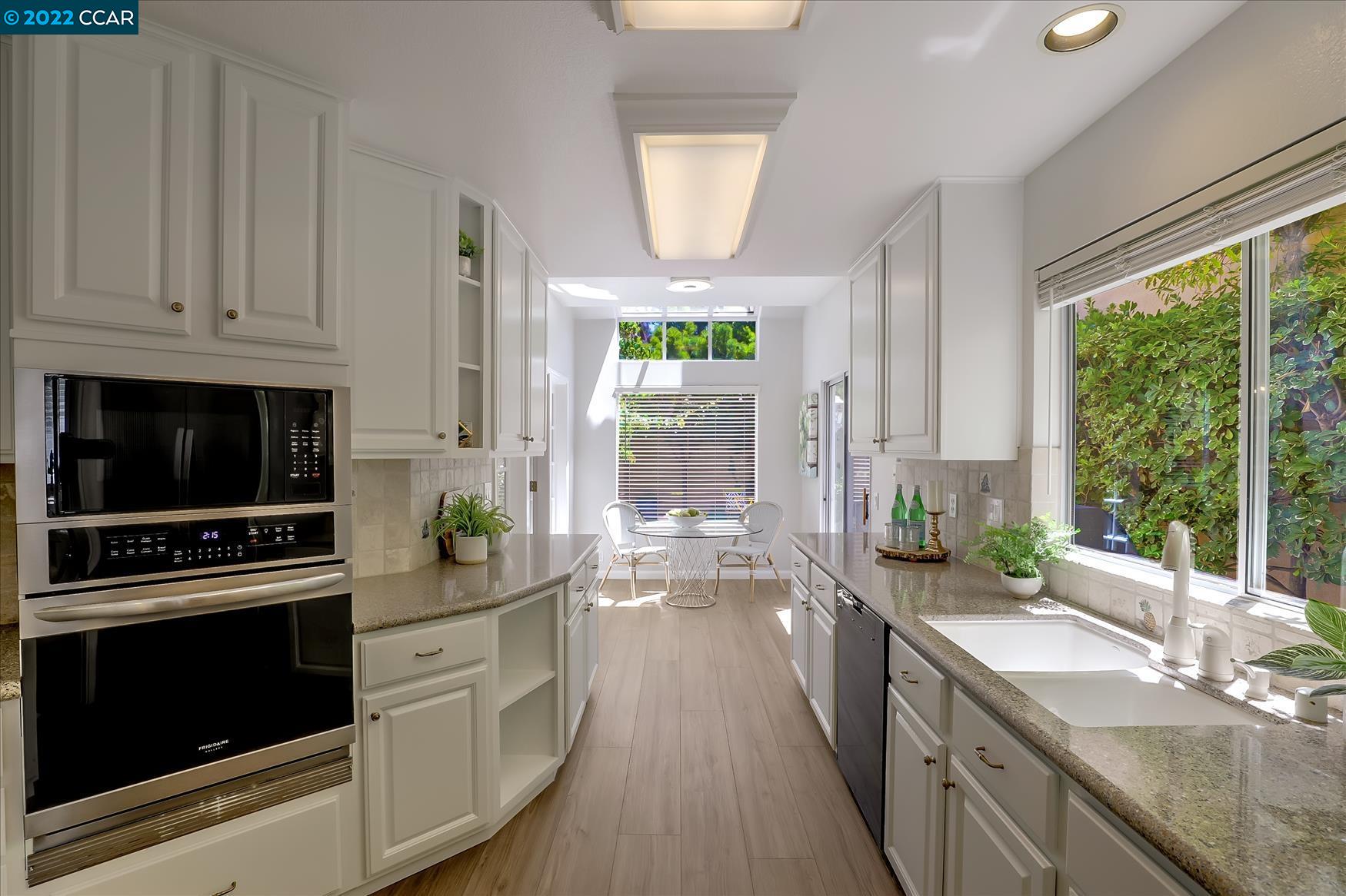 388 Catalan Way San Ramon, CA 94582 - Photo 11 of 52 a kitchen with stove a sink and cabinets