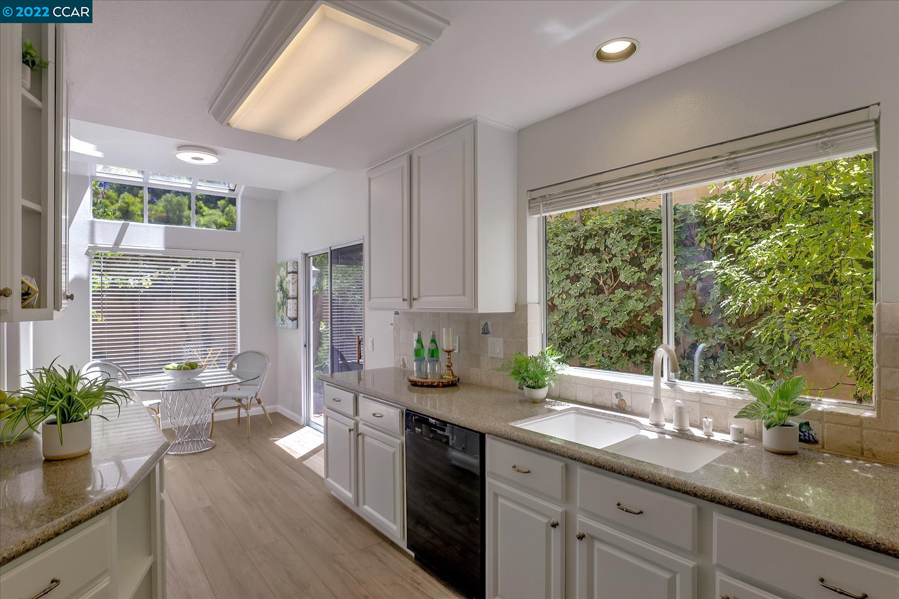 388 Catalan Way San Ramon, CA 94582 - Photo 13 of 52 a kitchen with sink and wooden floor