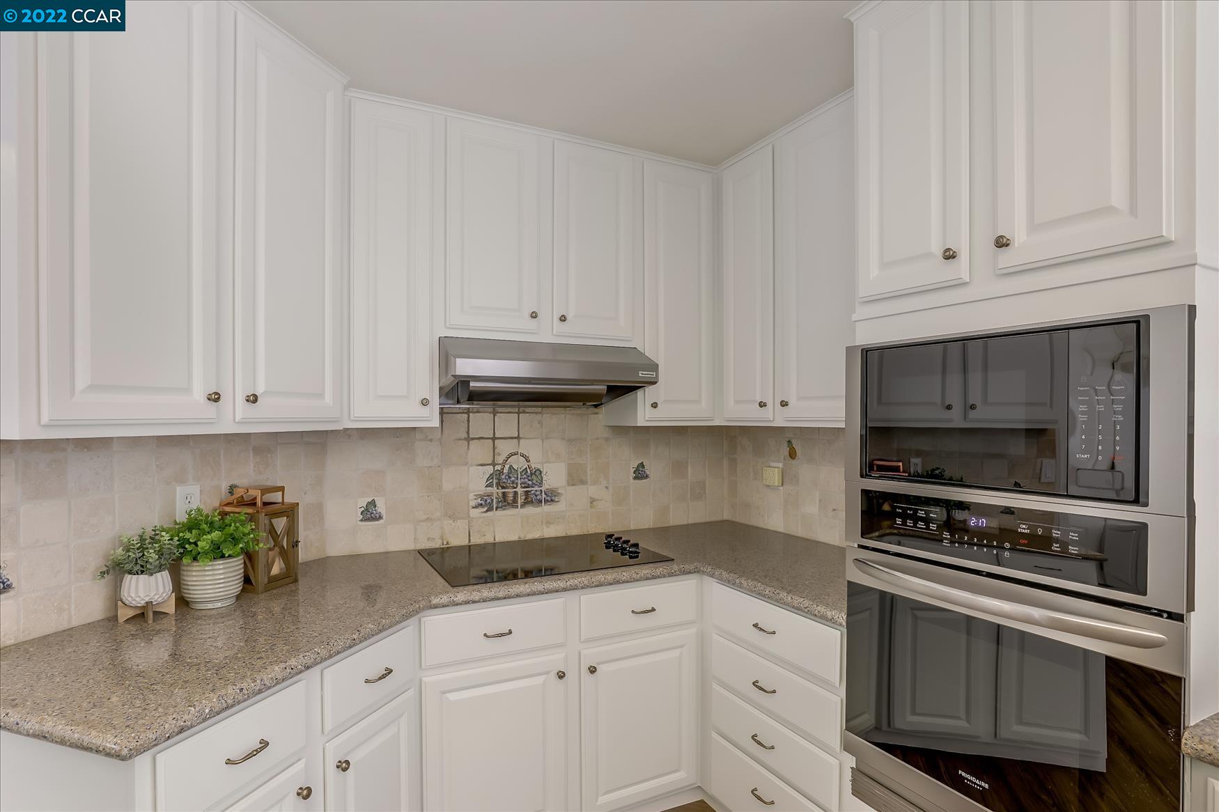 388 Catalan Way San Ramon, CA 94582 - Photo 16 of 52 a kitchen with granite countertop white cabinets and stainless steel appliances