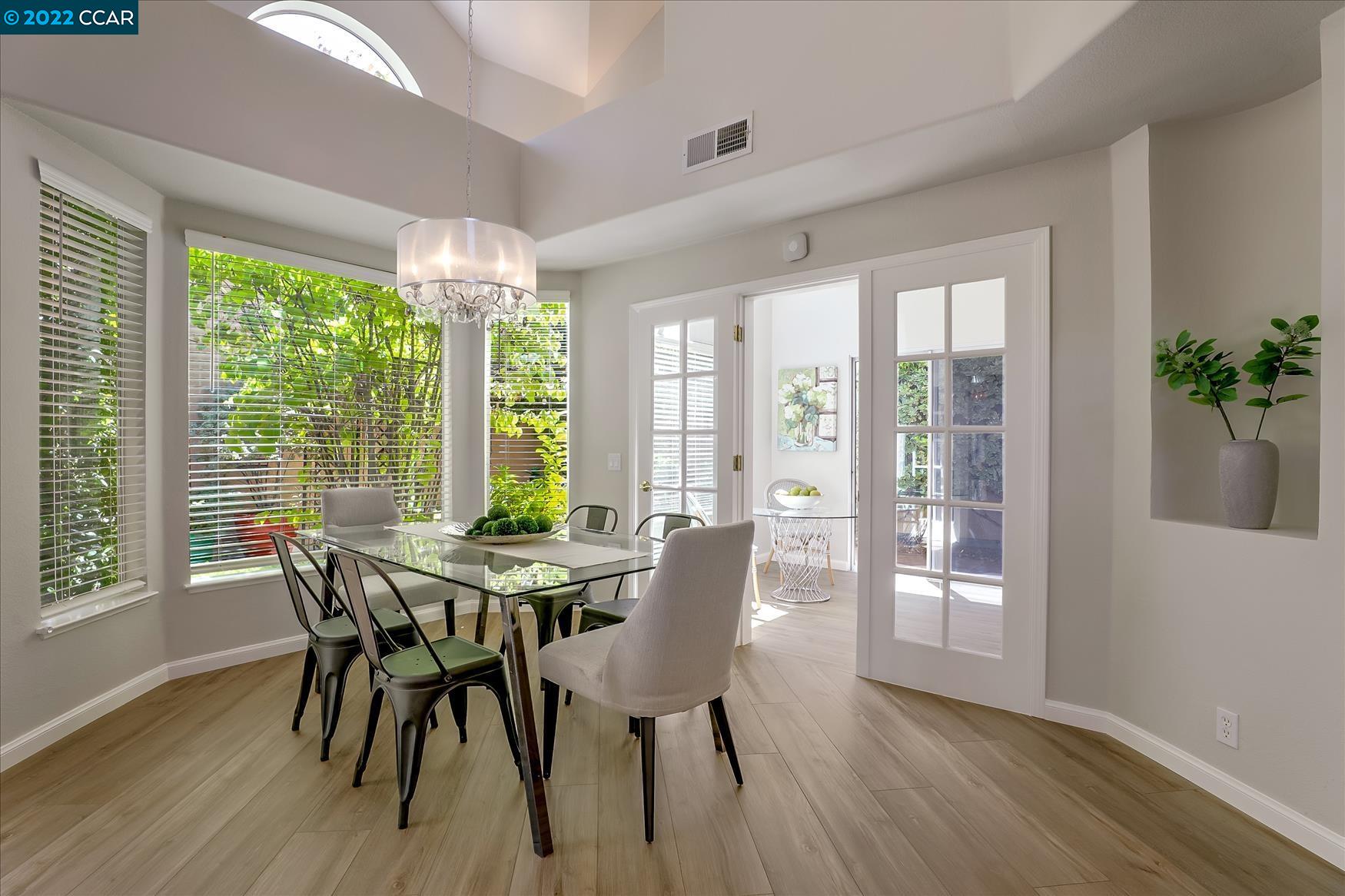 388 Catalan Way San Ramon, CA 94582 - Photo 21 of 52 a view of a dining room with furniture window and wooden floor
