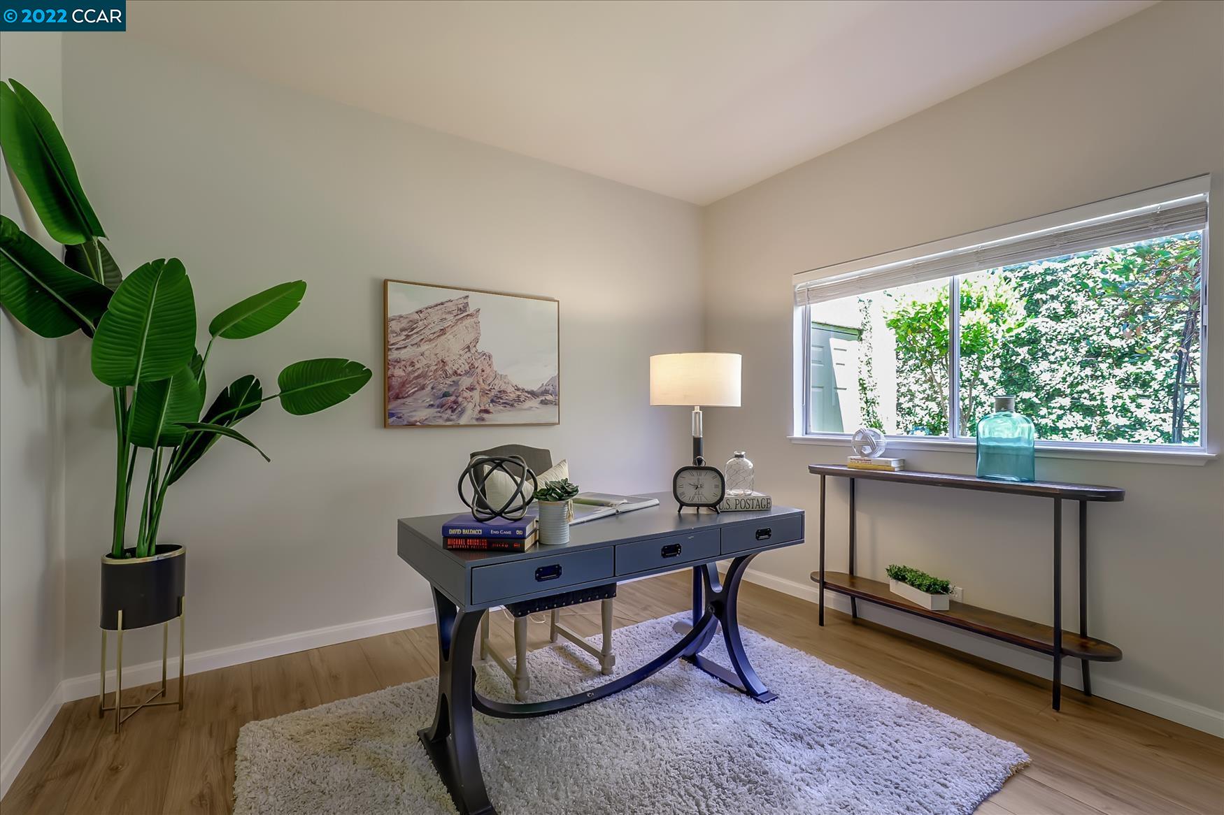 388 Catalan Way San Ramon, CA 94582 - Photo 22 of 52 a view of a workspace with furniture and a potted plant